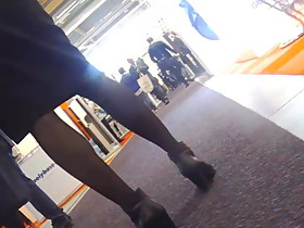 Candid legs in pantyhose and boots at expo