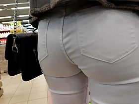 Juicy ass girl in tight white jeans